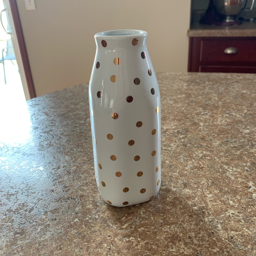 White vase with gold dots